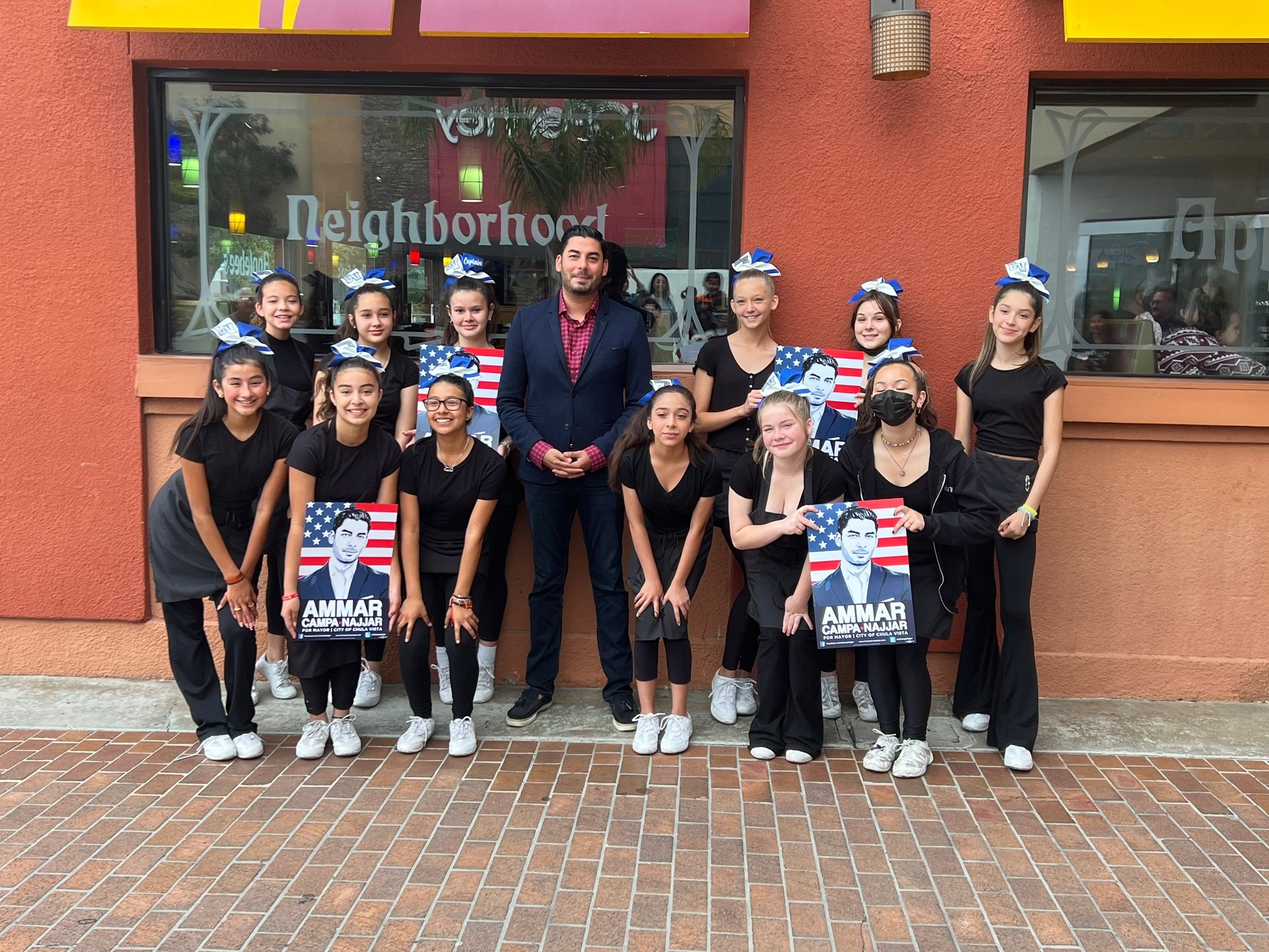 Ammar with cheerleaders from Bonita Vista Middle School.