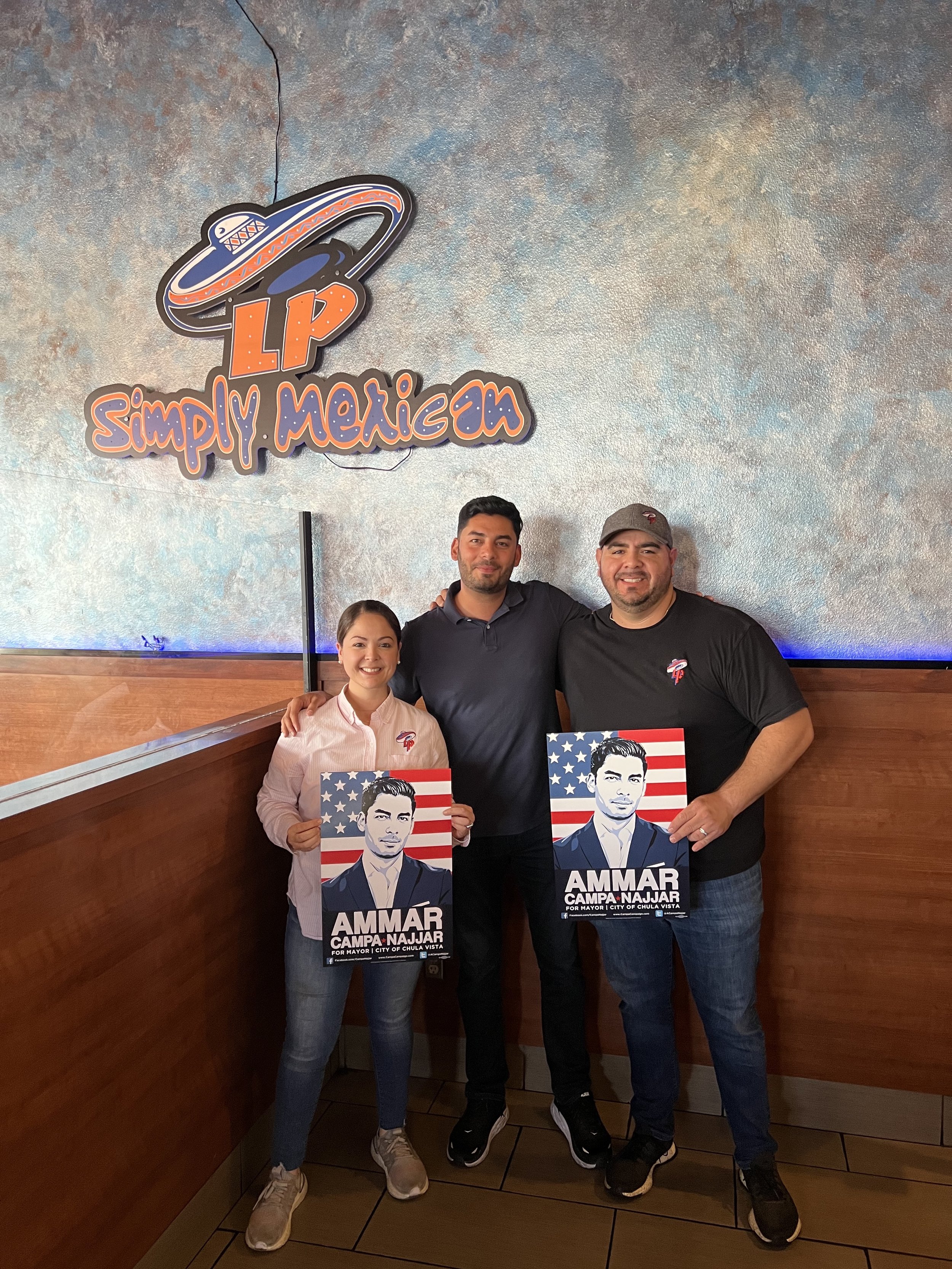 Ammar with the owners of Los Panchos Taco Shop.